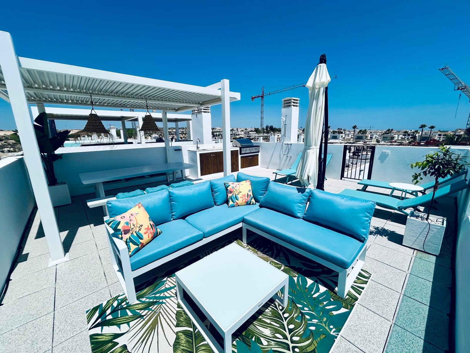 Dakterras loungeset blauwe kussens